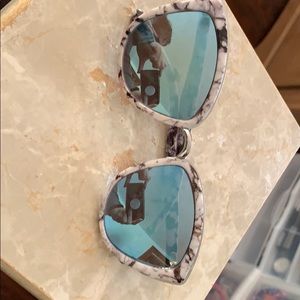 Reflective marble print and blue lense sunglasses